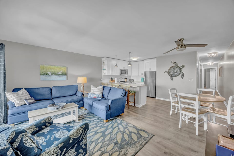 Relax in your bright, coastal-inspired living space with comfy seating, a fully equipped kitchen, and beachy décor that brings the ocean inside.