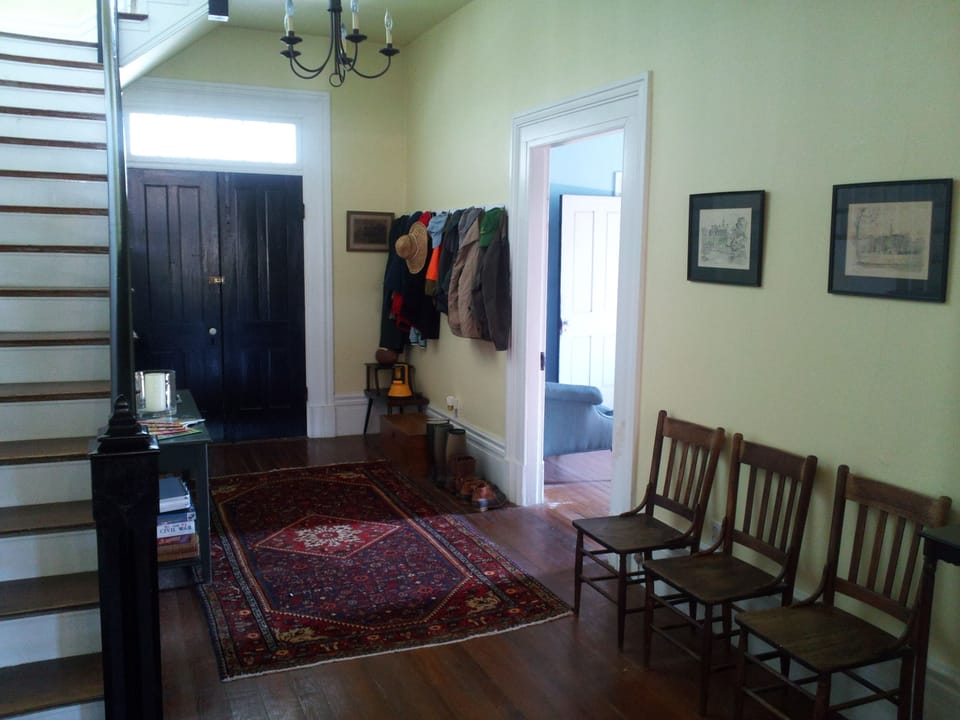 The back hall that leads to the screened porch and back yard.