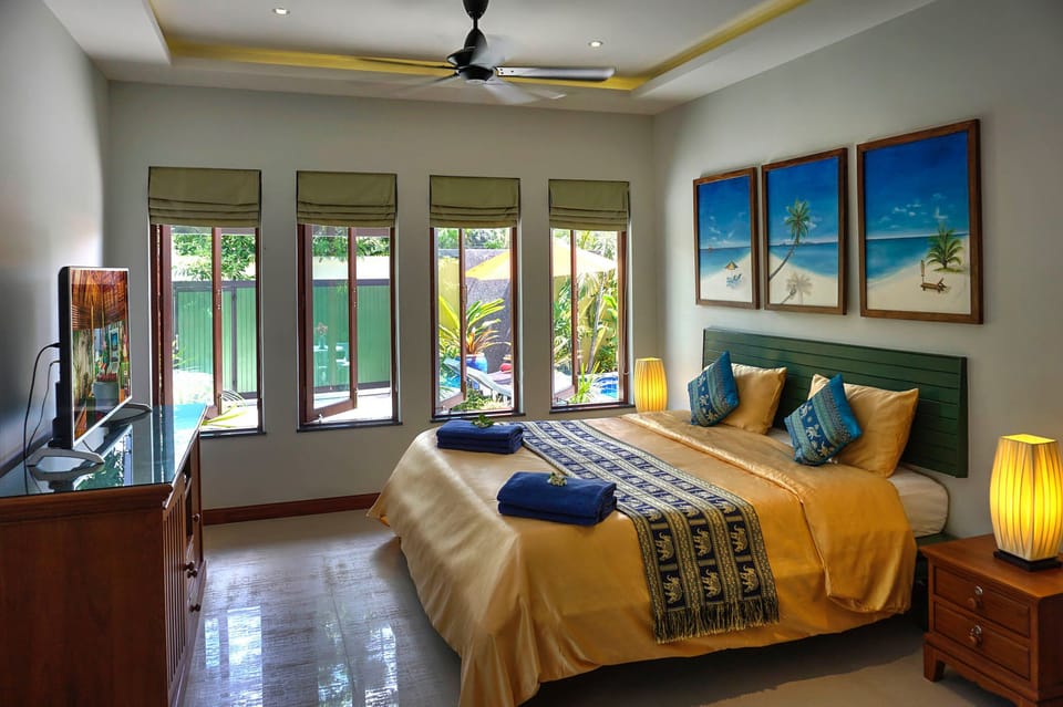 Spacious Bedroom with air conditioning and overhead fans 