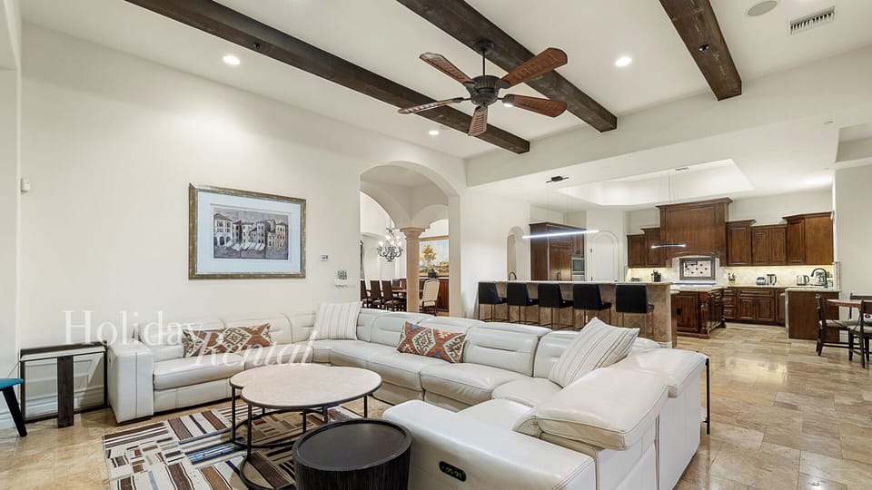 Soaring beamed ceilings, open kitchen & a patio that pulls you outside.