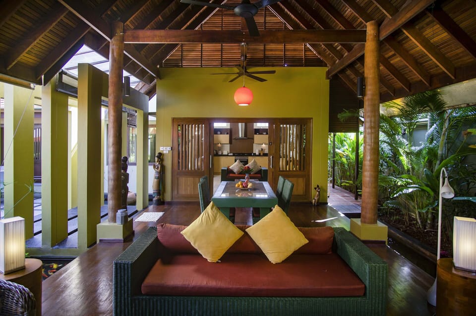 Open-plan Balinese/Thai-style living area with natural wood elements