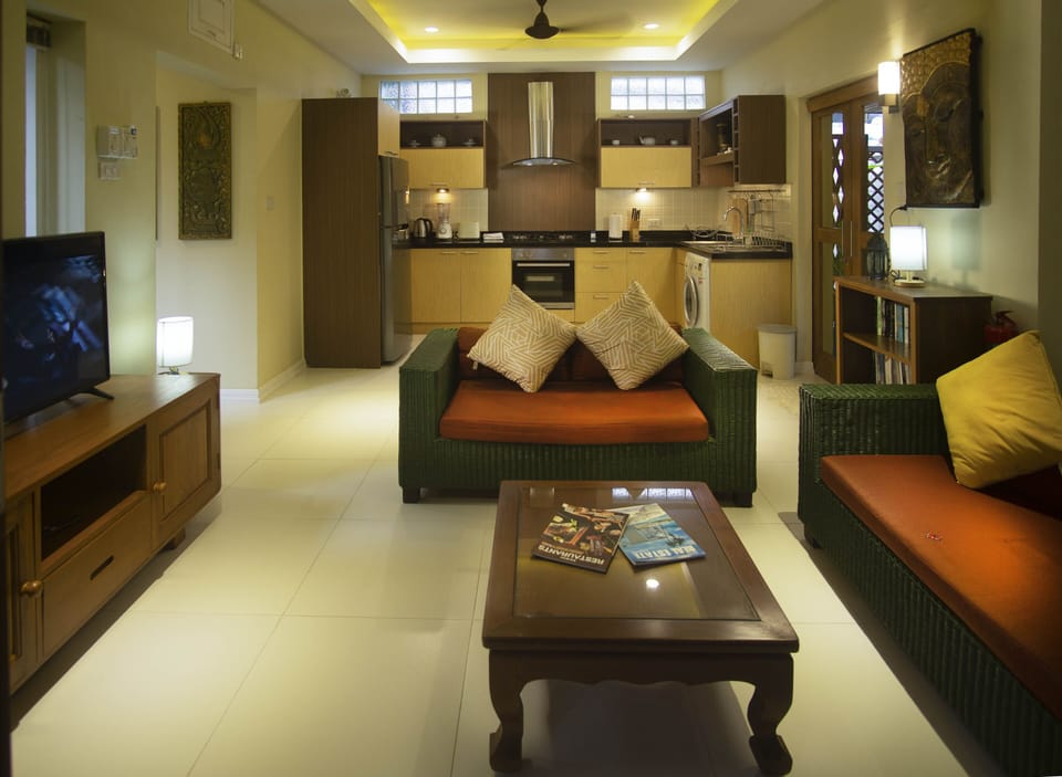 Spacious air conditioned living area with open access to fully equipped kitchen