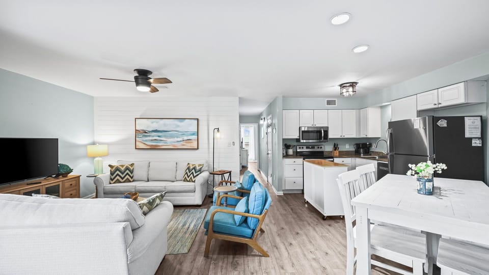 Sandpiper 10C - This open layout seamlessly connects the living area, dining, and kitchen, creating a spacious flow perfect for gathering, dining, and relaxing together.