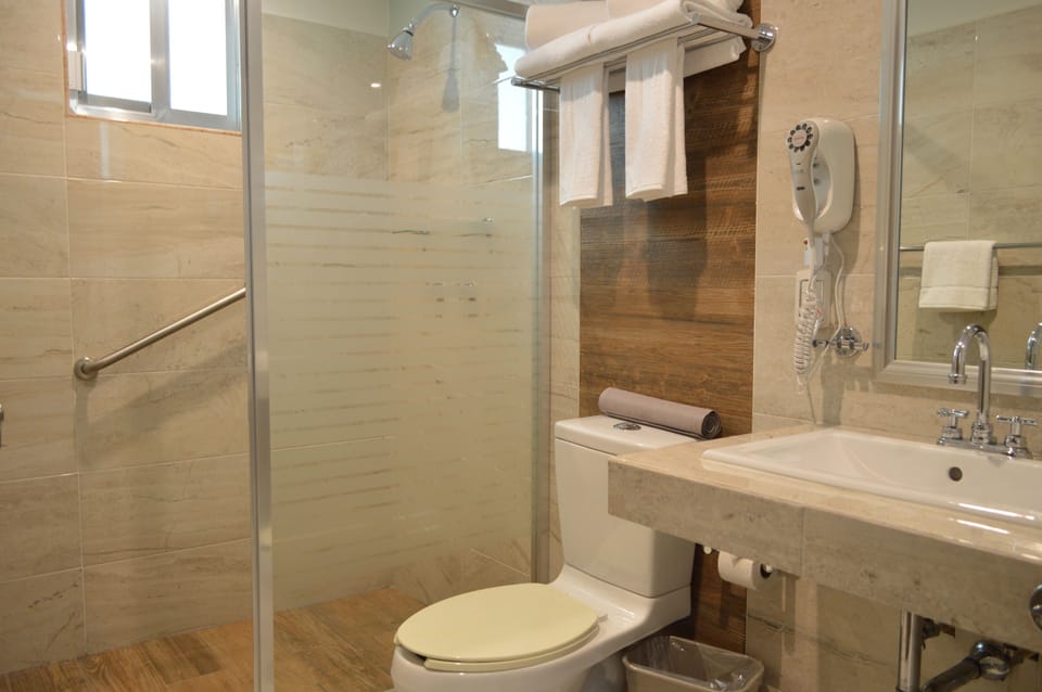 Shower, rainfall showerhead, free toiletries, hair dryer