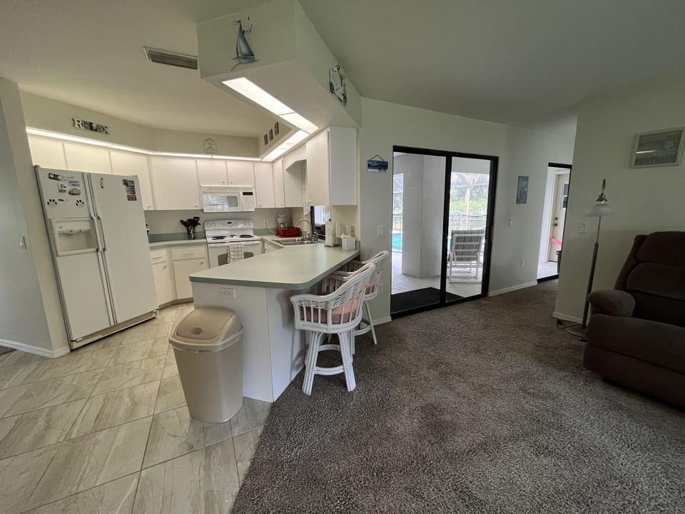 Bright Kitchen with lots of pot and pans for your cooking enjoyment
