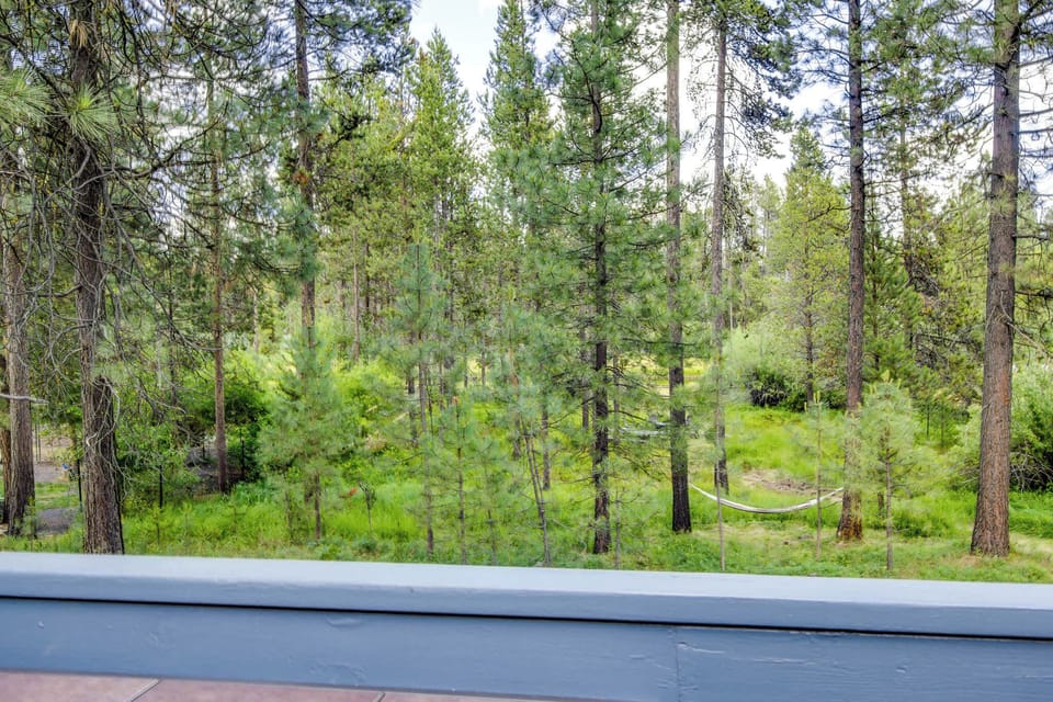 View of the back property of the home from the deck. 