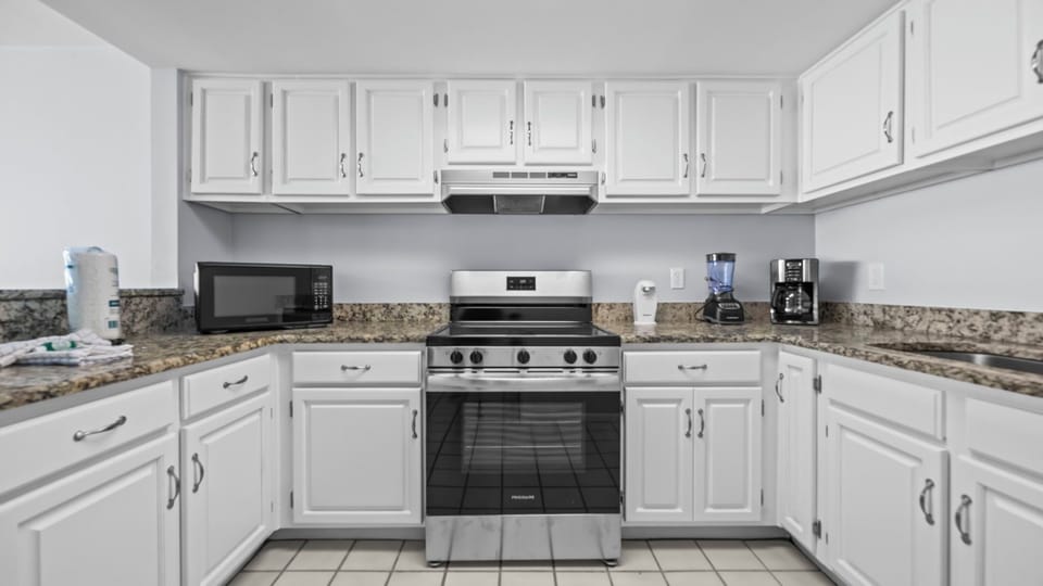 Edgewater West 95 - Kitchen with all essential appliances and tools for easy meal preparation.