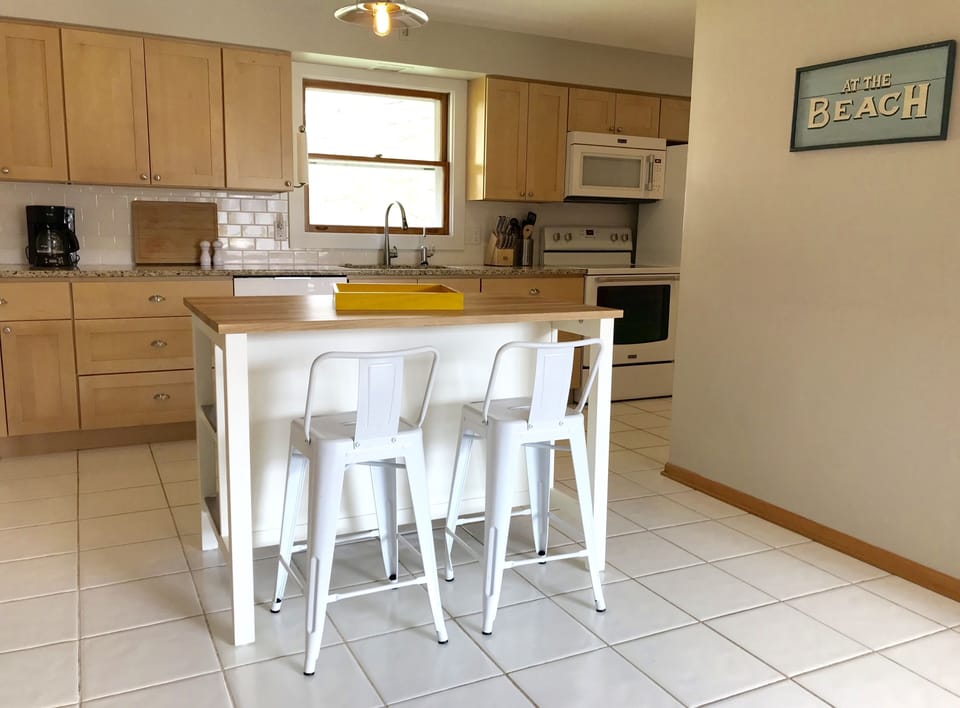Fully stocked modern kitchen with room to cook and gather.  