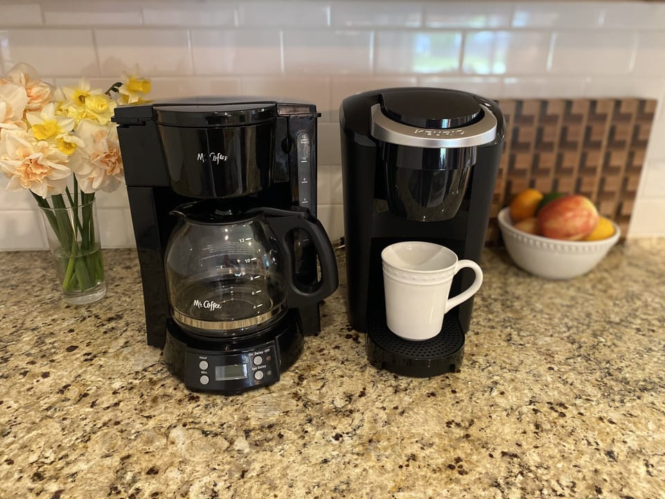 The kitchen has both a traditional drip coffee maker and a Keurig single serve. 