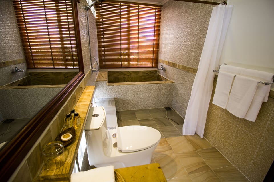 Superior Room | Bathroom | Hair dryer, slippers, bidet, towels