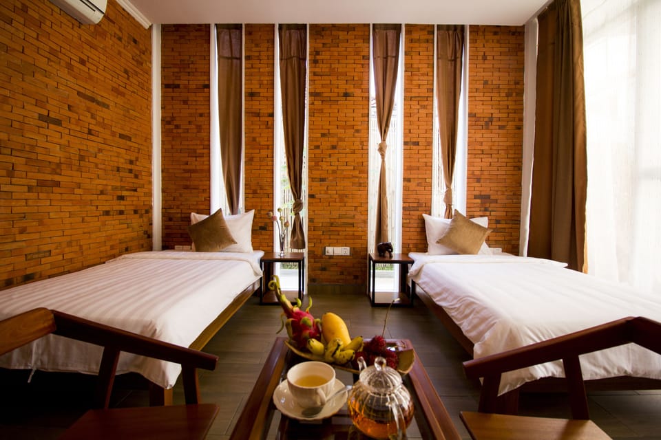 Exclusive Twin Room, Pool View | Minibar, in-room safe, desk, laptop workspace