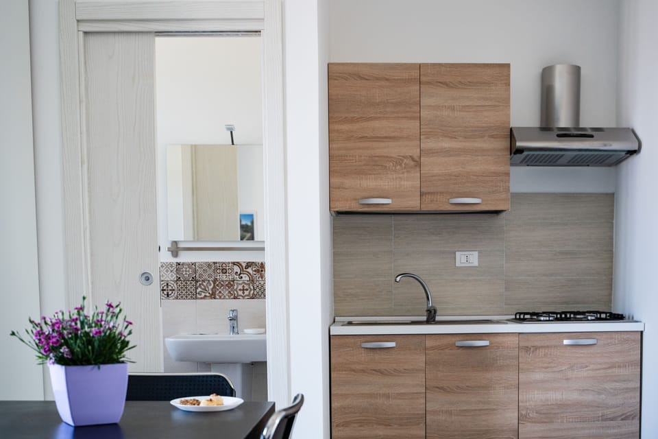 Family Room, Multiple Beds, Partial Sea View | Private kitchenette