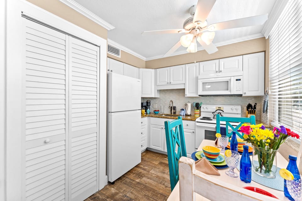Beautiful dining area by the window, located between the living and kitchen spaces. 

Convenient in-unit laundry so you can pack light.