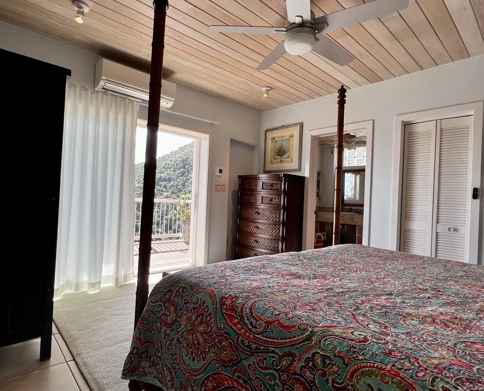 Large glass sliders provide unobstructed view of the Caribbean from both bedrms.