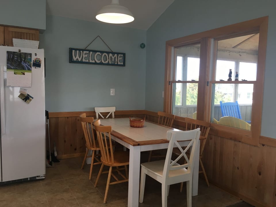 Dining area inside, also a dining area on porch