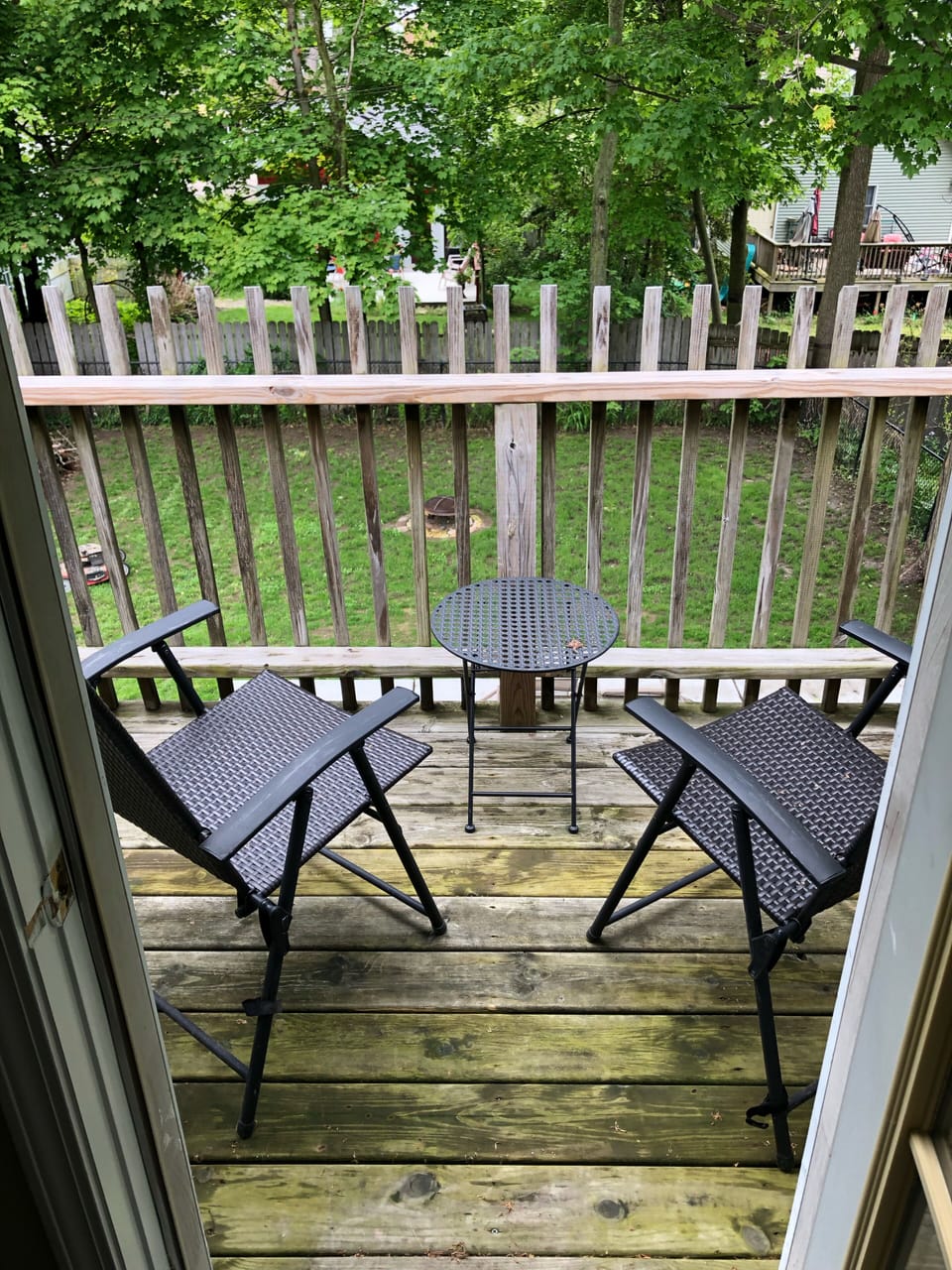 Small balcony with seating off of master bedroom