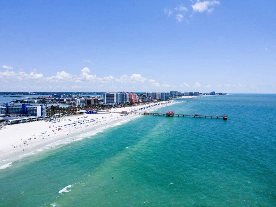 Whether you're lounging by the heated courtyard pool or walking to dinner on Mandalay Avenue, it is the ideal base for couples or small families seeking a peaceful beach escape.