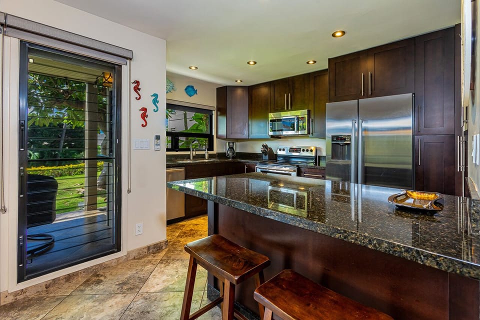 Kitchen island has seating for two. 