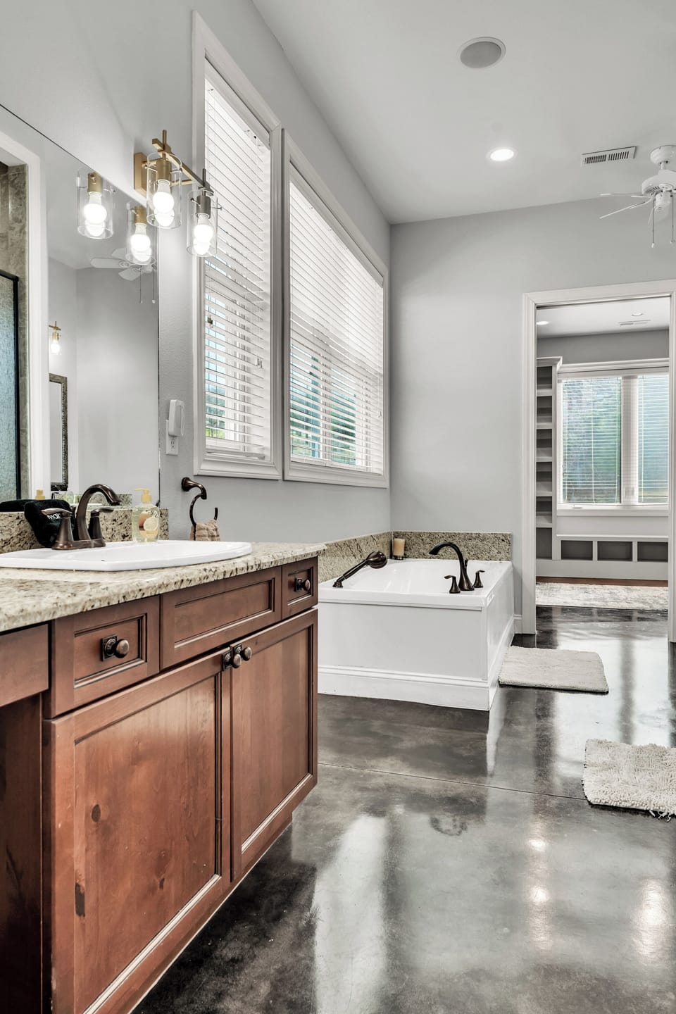 Large en suite primary bath with walk in closet, soaking tub and walk in shower.