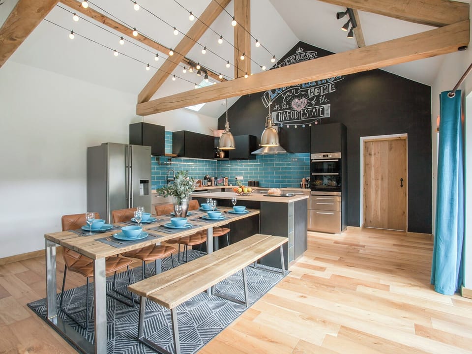 Lovely wood-floored living space | The Pendre Longbarn, Pont-Rhyd-y-Groes, near Ystrad Meurig