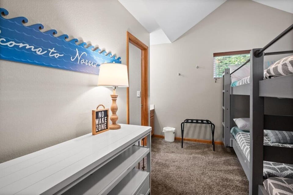 Upper level bunk room, 4 full size beds, en suite vanity, Jack & Jill bathroom