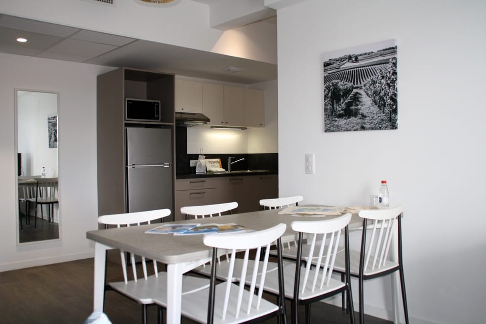 Prepare meals in the kitchenette and enjoy them at the dining table.