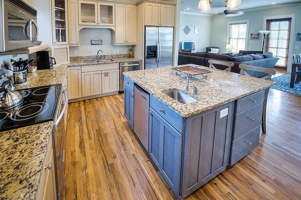 Kitchen Island, Stools, Refrigerator, and Coffee Table.