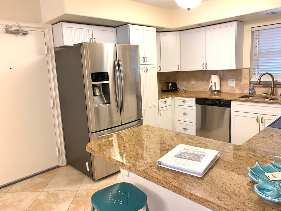 Fully equipped kitchen with granite counters and stainless appliances