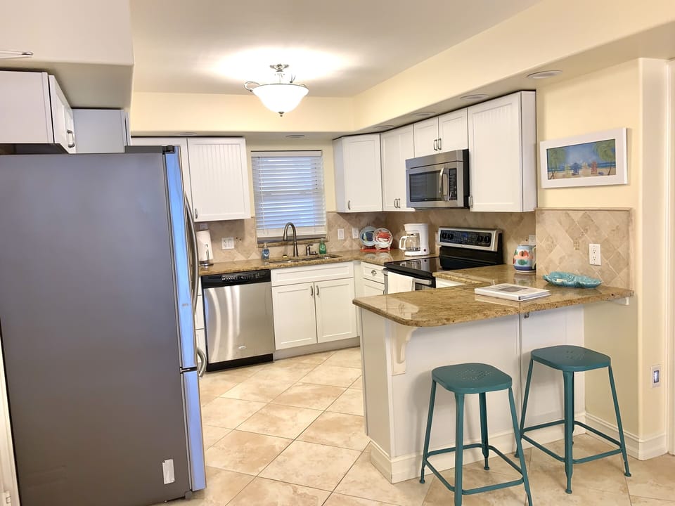 Fully equipped kitchen with granite counters and stainless appliances