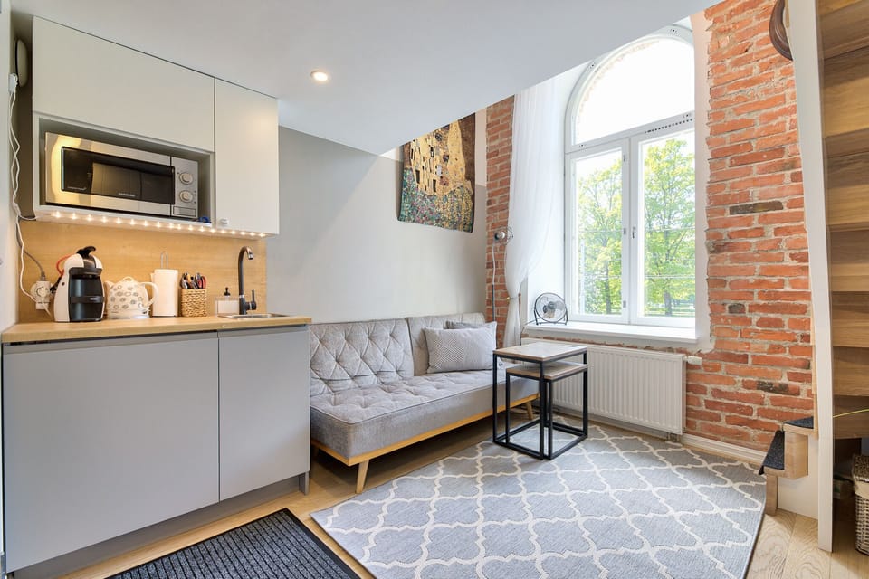 Compact kitchenette for breakfast, cozy living area to relax.