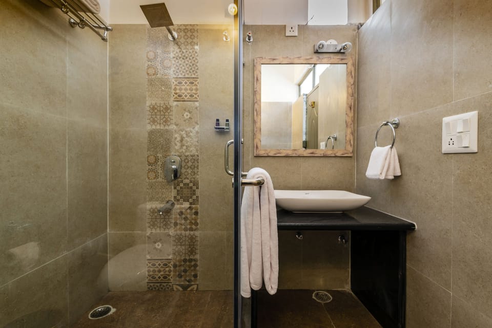 Shower, free toiletries, hair dryer, slippers