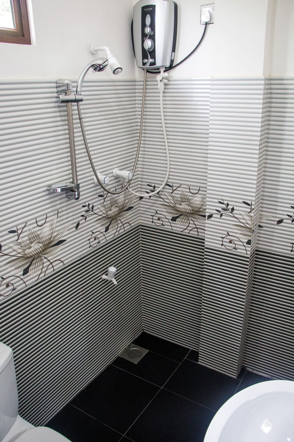 Economy Triple Room, 1 Twin Bed, River View | Bathroom | Shower, free toiletries, towels