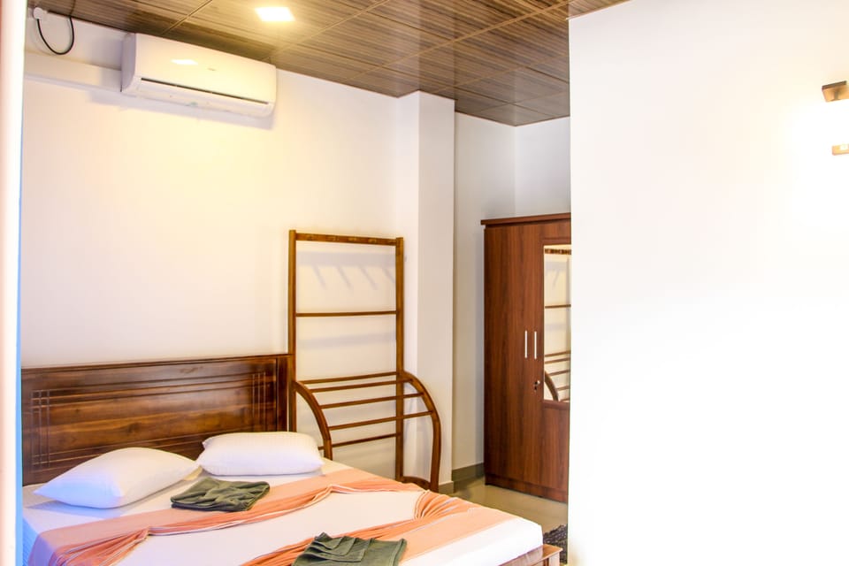 Economy Triple Room, 1 Twin Bed, River View | Bathroom | Shower, free toiletries, towels