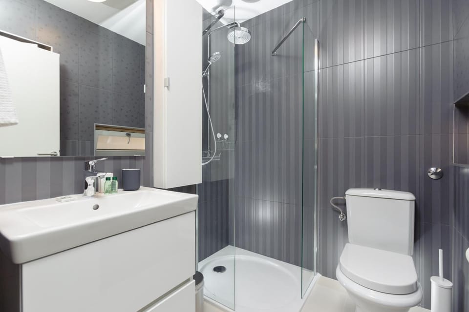 Shower, designer toiletries, hair dryer, bathrobes