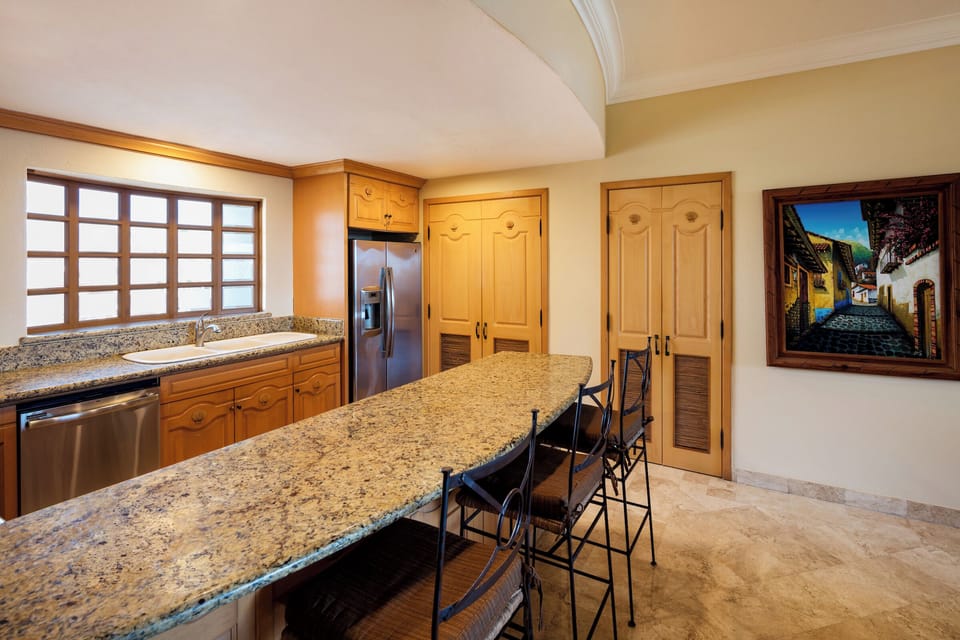 Large kitchen with laundry, pantry, granite and stainless appliances.