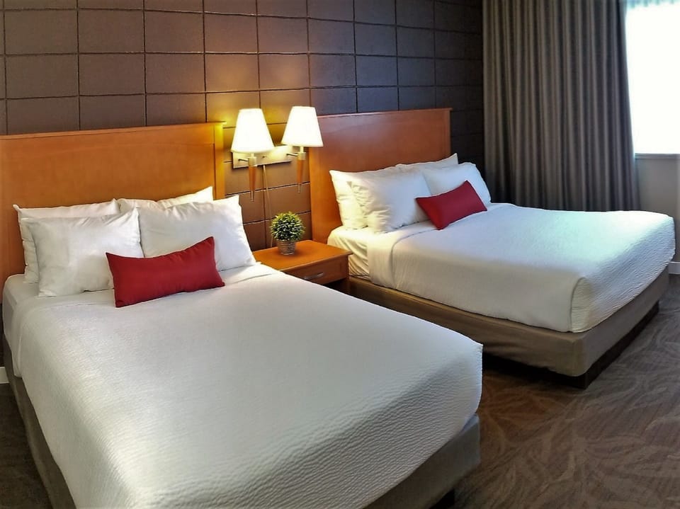 Premium bedding, down comforters, pillowtop beds, blackout drapes