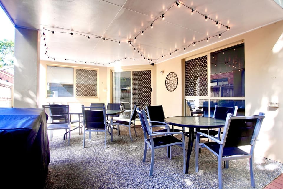 Outdoor dinning and BBQ Seating for 10 with 4 extra seats.