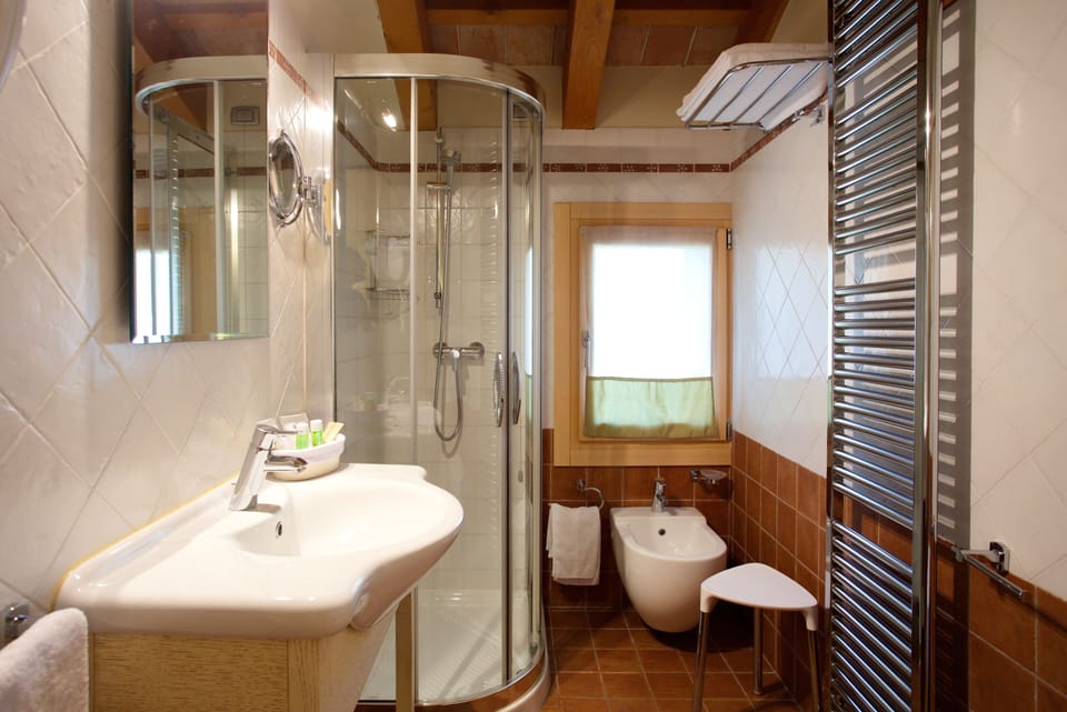 Shower, free toiletries, hair dryer, slippers