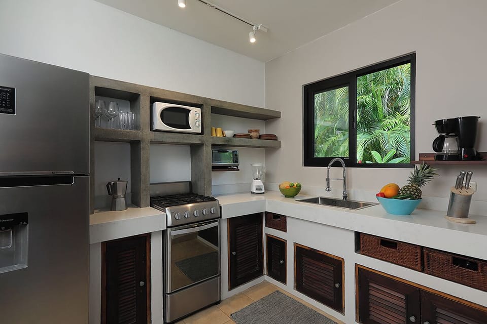 Deluxe Villa, Multiple Beds, Partial Ocean View | Private kitchen | Coffee/tea maker, fridge, microwave, oven