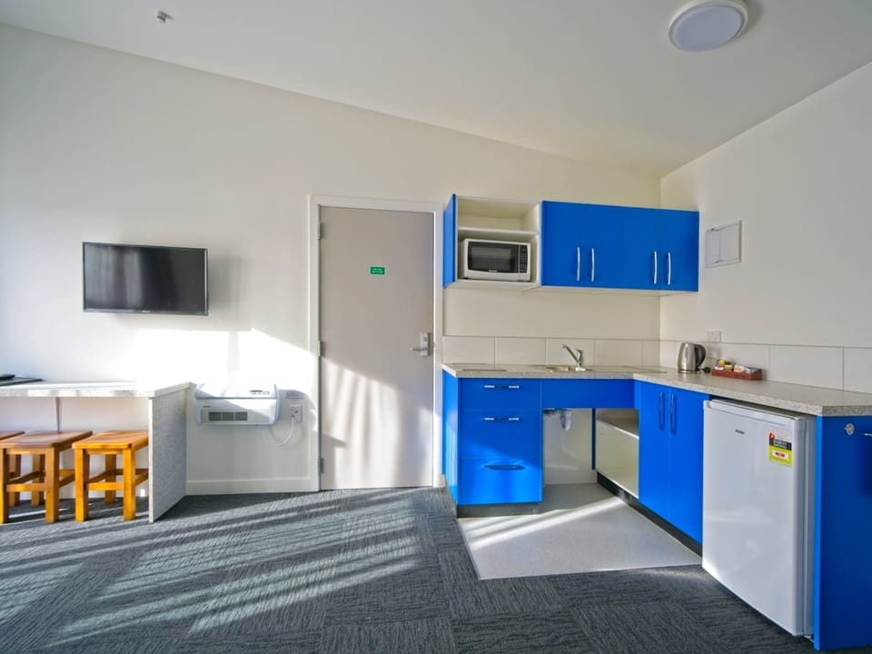 Two Bedroom Access Motel Unit | Private kitchenette | Shared fridge, shared microwave, highchair, cookware/dishes/utensils