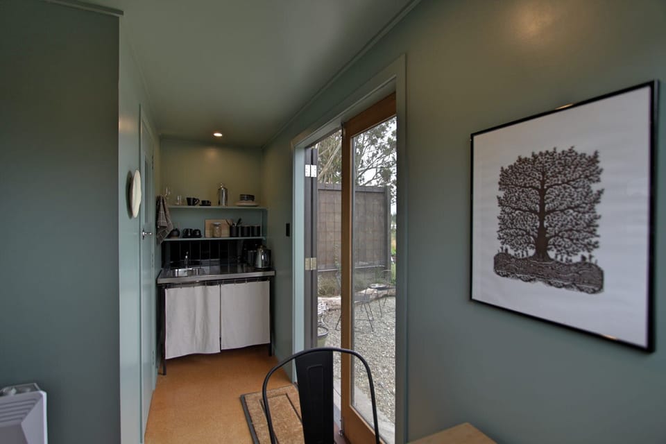 The little kitchen nook includes a fridge, kettle and toaster.