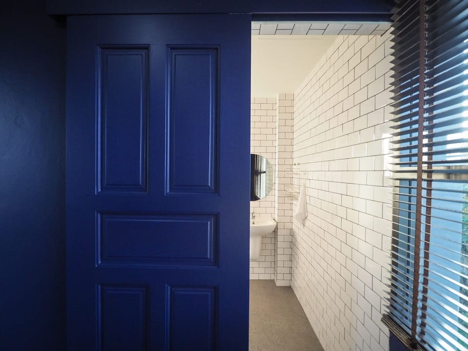 Basic Twin Room, 2 Twin Beds, City View | Bathroom | Shower, free toiletries, hair dryer, slippers