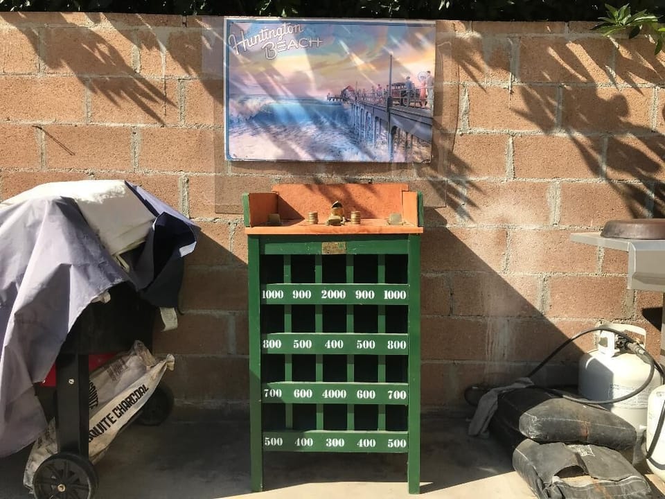 Sapo Peruvian  Game. 
https://youtu.be/15iMaT3aye0