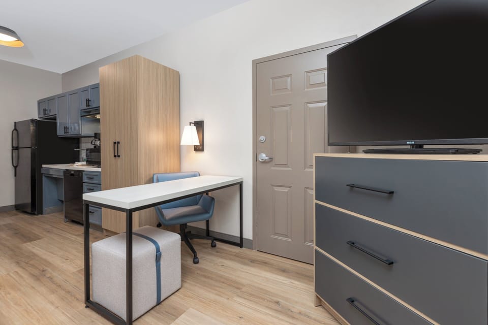 Desk, laptop workspace, blackout drapes, iron/ironing board