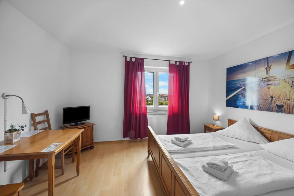 Double Room | Desk, blackout drapes, cribs/infant beds, rollaway beds