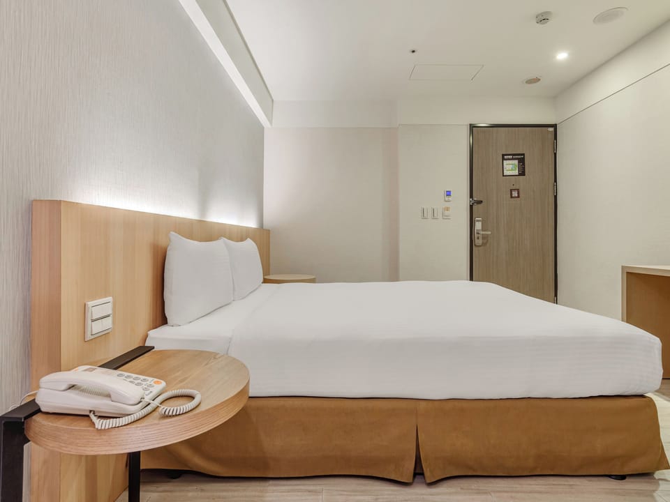 Standard Double Room, No Windows | Down comforters, minibar, desk, blackout drapes