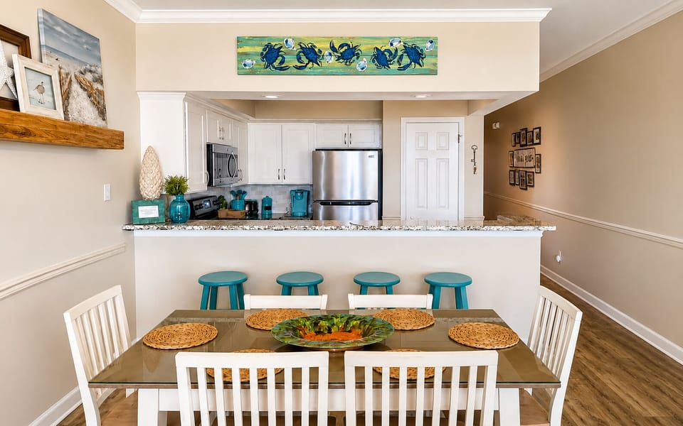 Open kitchen and dining area with seating for six plus four at the breakfast bar