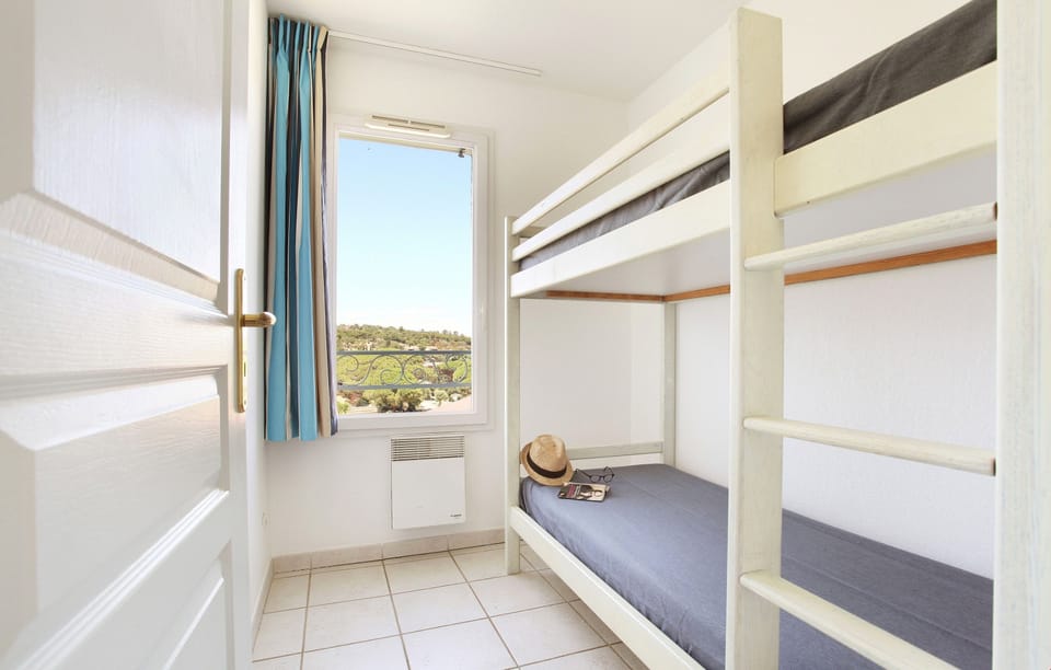 Drift to sleep in the third bedroom with a Bunk bed.