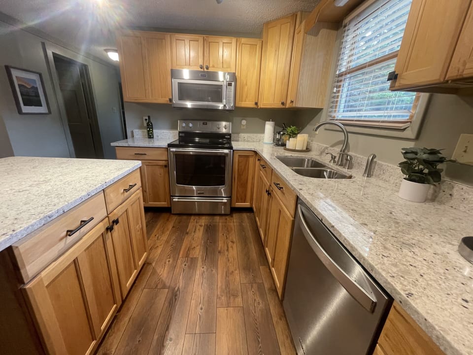 Chef's fully stocked kitchen with blender, crock post, Keurig, waffle maker, etc