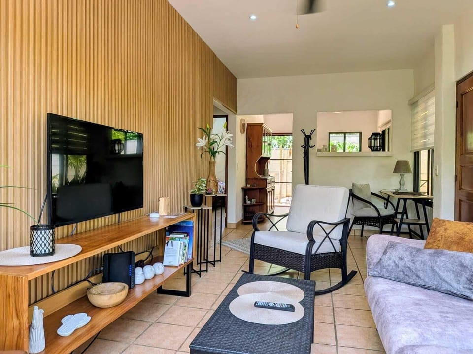 Standard Apartment | Living area | 30-inch LCD TV with cable channels, TV, Netflix
